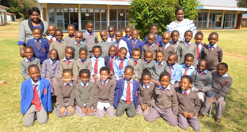 Above: Mrs Ndava and Mrs Simango  with Grade Grade 1Red